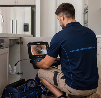 Clearing a blocked sink at a Mosman property